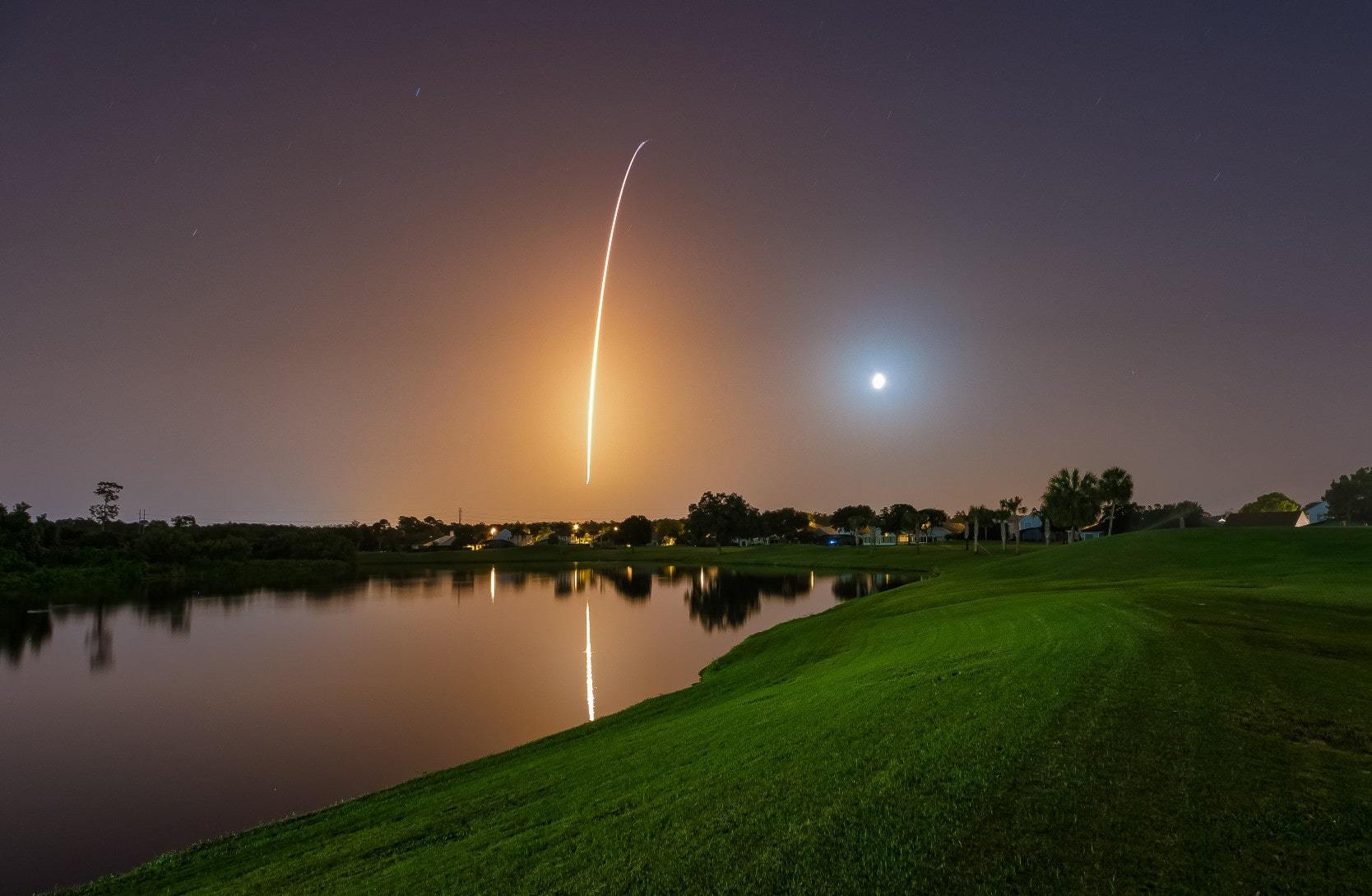 Trail of a rocket against the night sky in Cape Canaveral, Florida